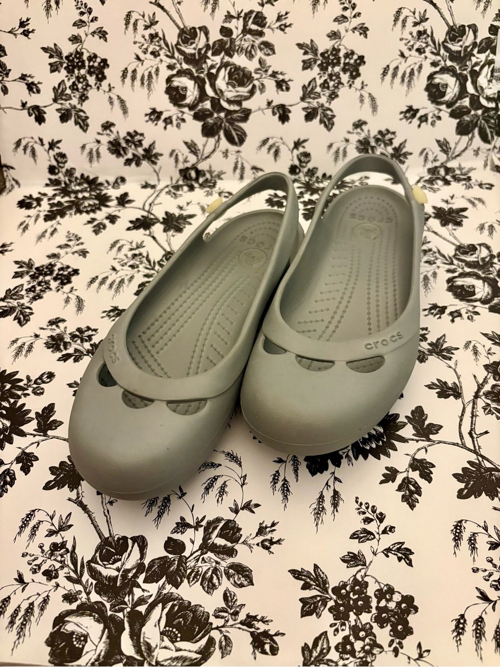 CROCS Flats in Pale Gray with Flower Accent